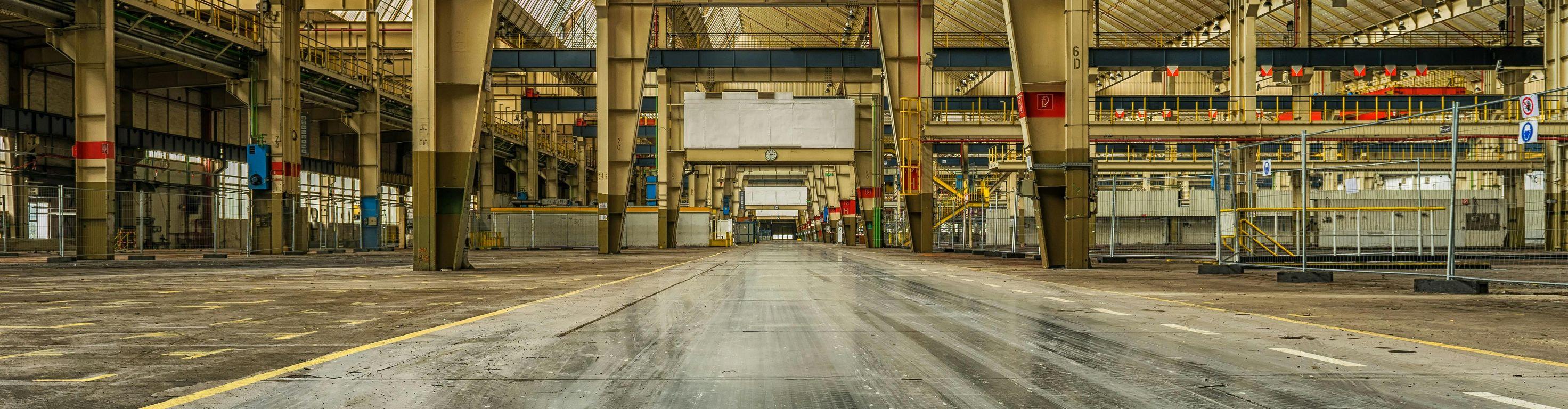 Huge industrial warehouse or hanger, clean, organized, and empty