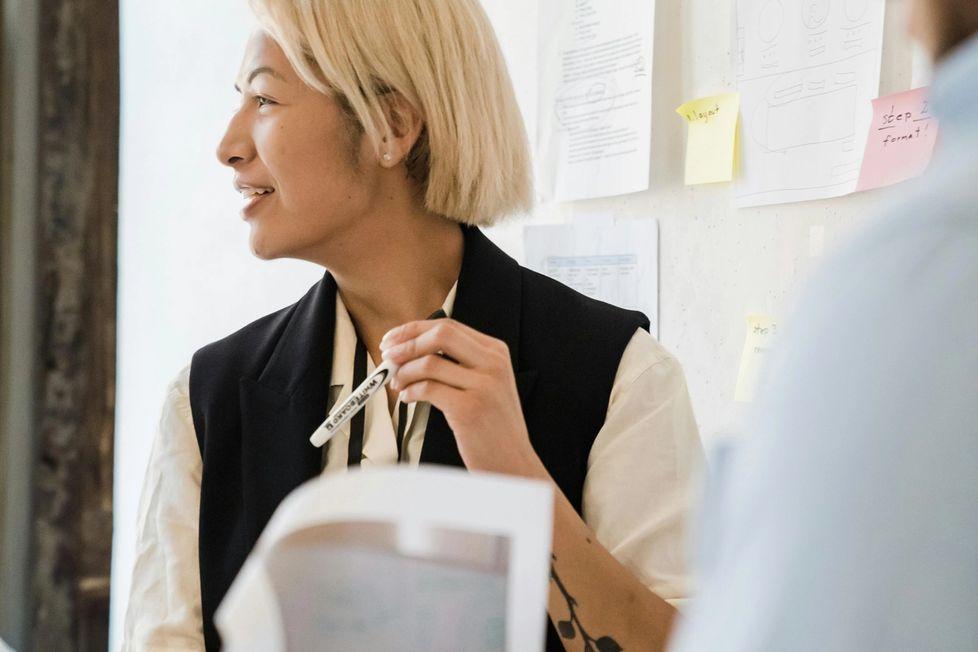 Woman in the office working with someone out of the frame