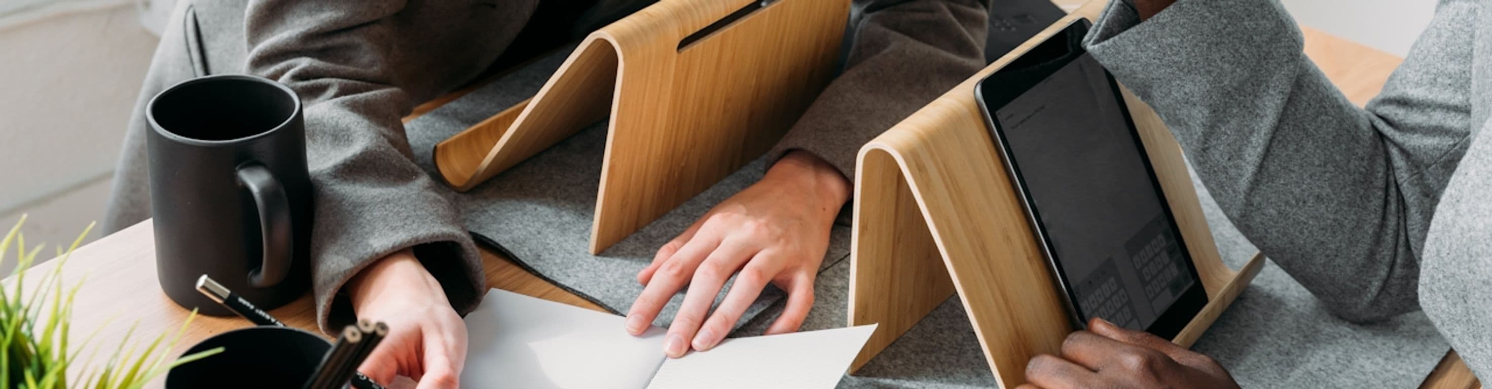 Close up of tablets hands and notebook