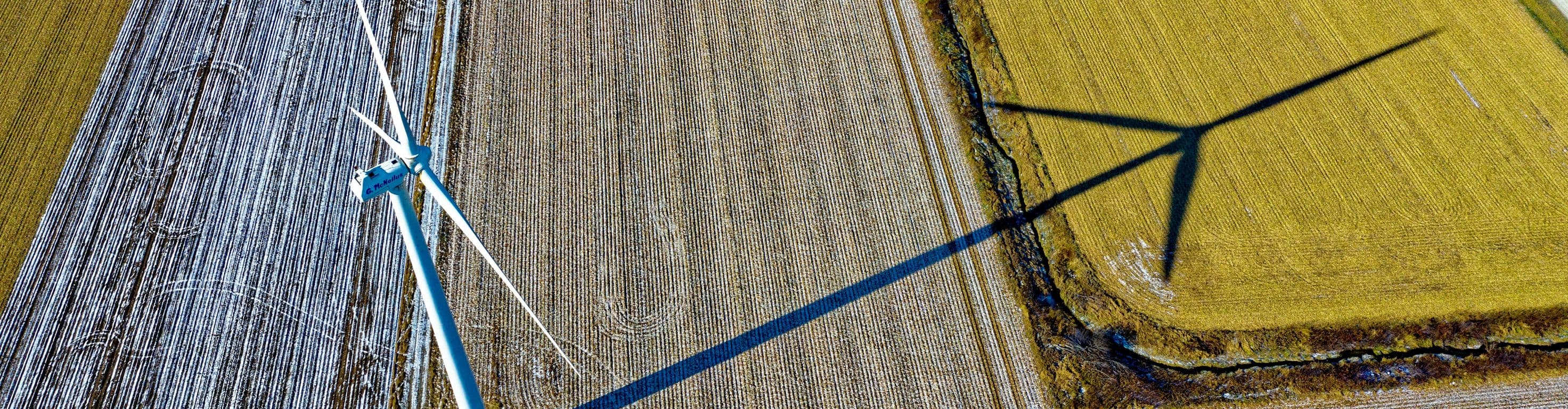 Wind turbine casting a shadow in an angular field