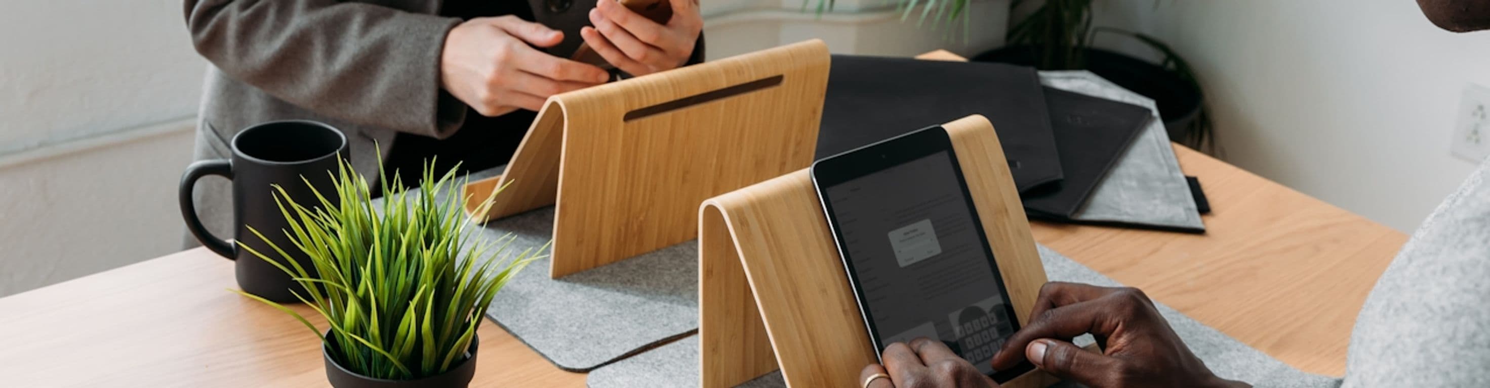 Close up of people working on tablets