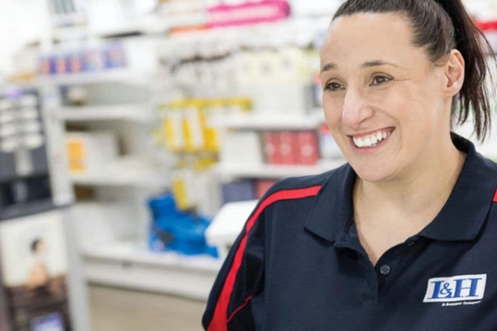 A women working at the checkout lane at Lawerence & Hanson.