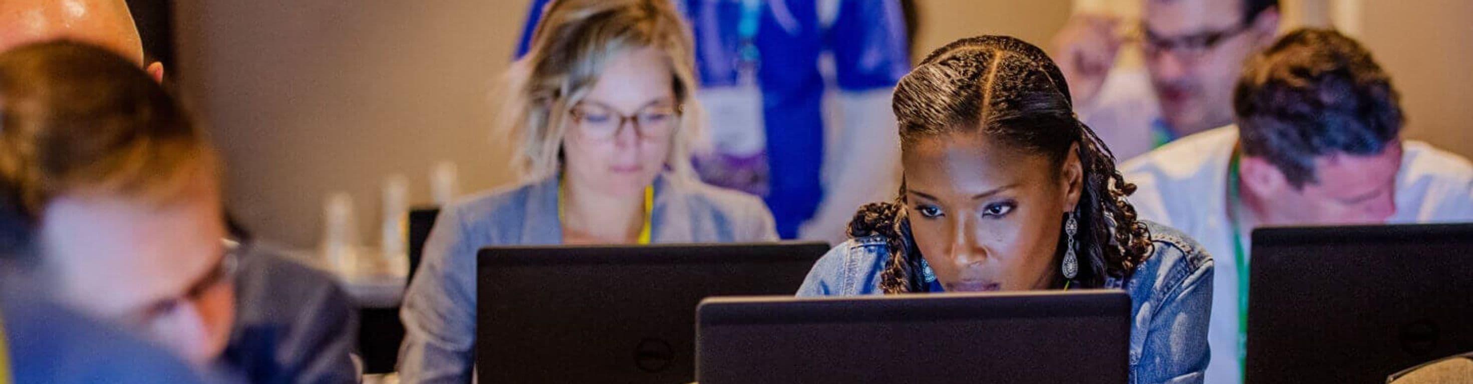 Peopl on computers at a Splash breakout session or workshop