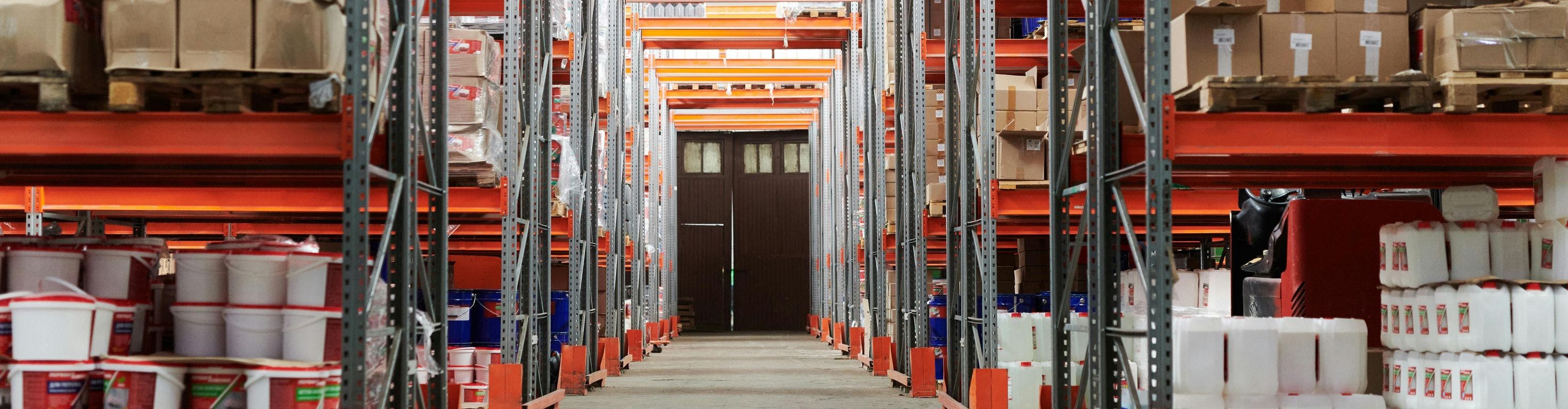 Orange warehouse with well-organized shelves